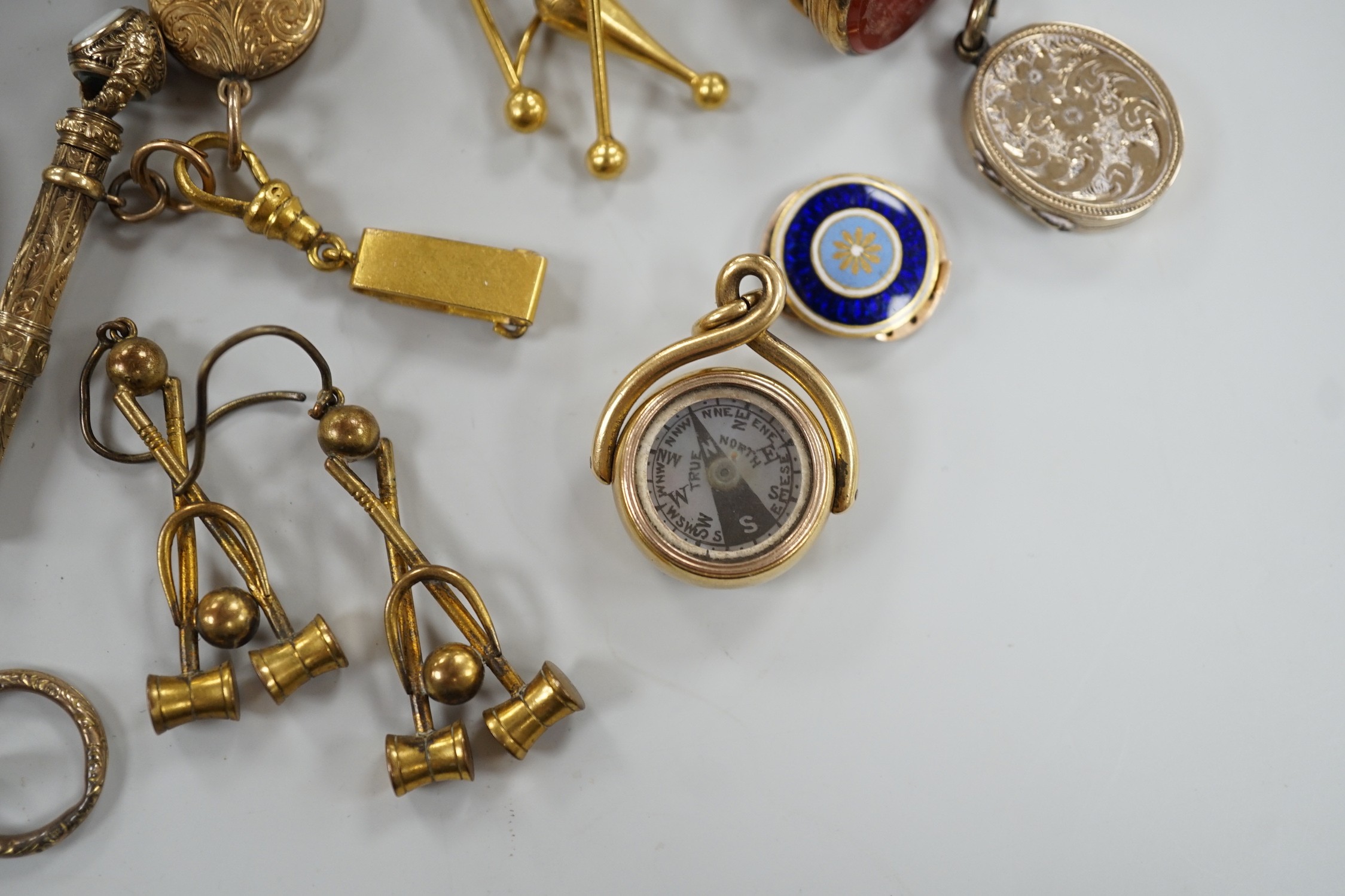 Mixed collectables including a yellow metal clam shell mourning pendant, 22mm, a George III yellow metal and plaited hair mourning brooch, with central urn and engraved inscription verso, three assorted 19th century and